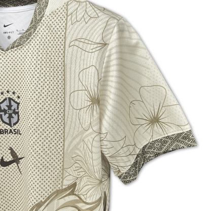 Close up of CBF Brasil crest and gold floral sleeve detailing on Brazil 2025/26 cream concept football shirt